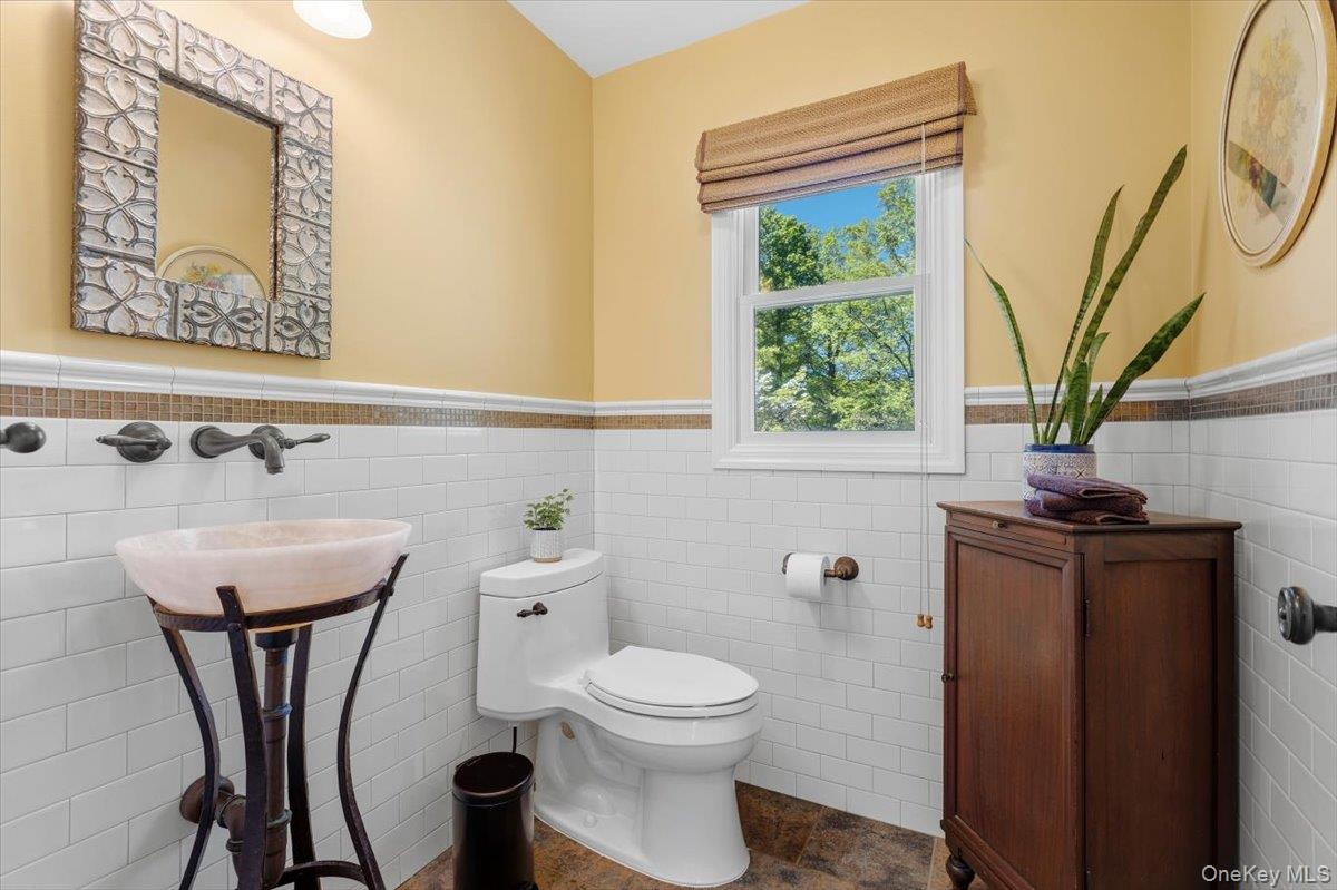 119 Edgewood Road Ossining, NY 10562 - Photo 18 of 50 The updated Powder Room on the main floor offers a floating pedestal sink with a wall-mounted faucet.