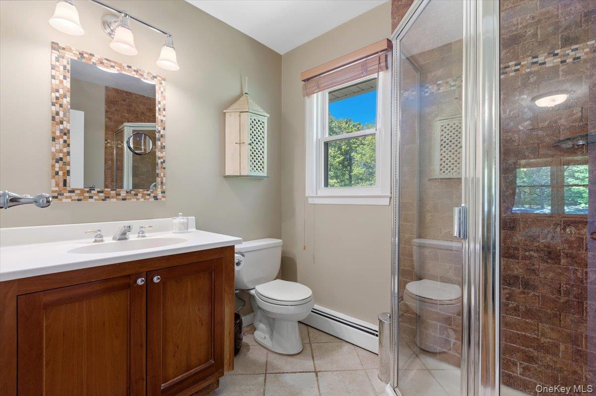 119 Edgewood Road Ossining, NY 10562 - Photo 25 of 50 Updated, tiled Primary Bathroom with a walk-in Shower.