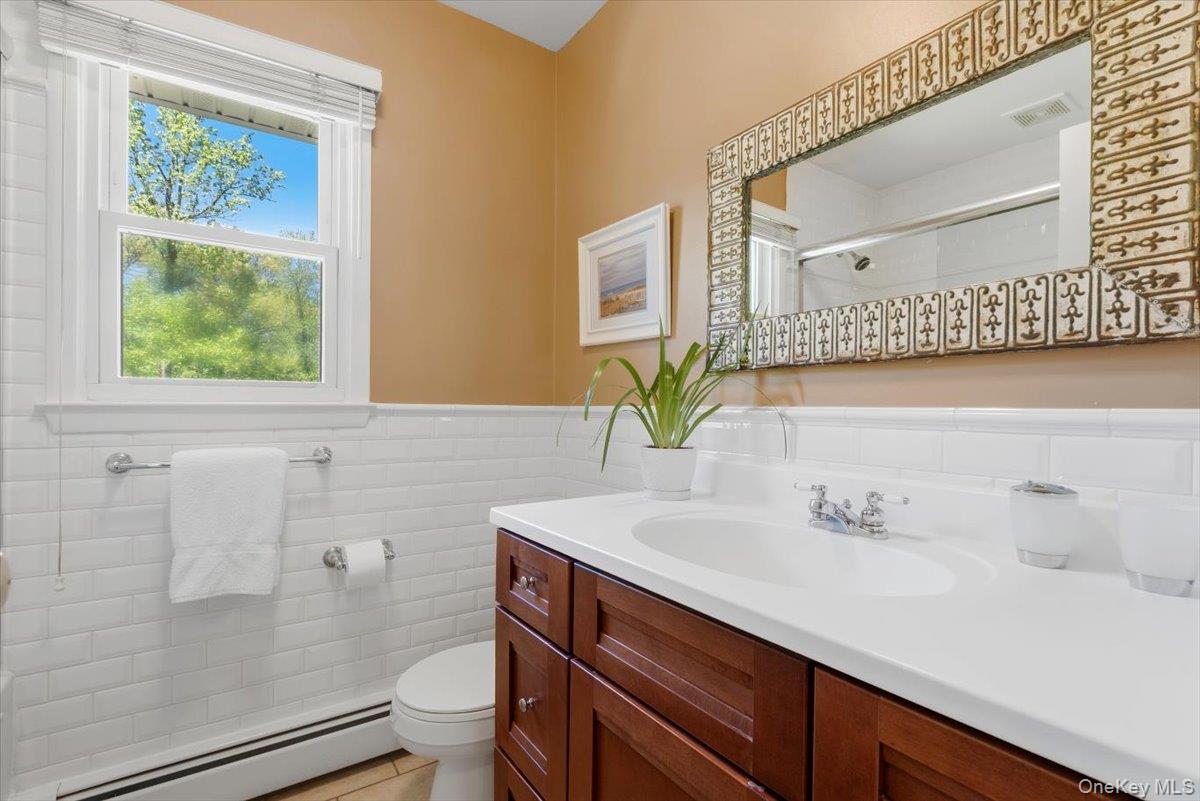 119 Edgewood Road Ossining, NY 10562 - Photo 28 of 50 The updated Hall Bathroom with a soaking tub.