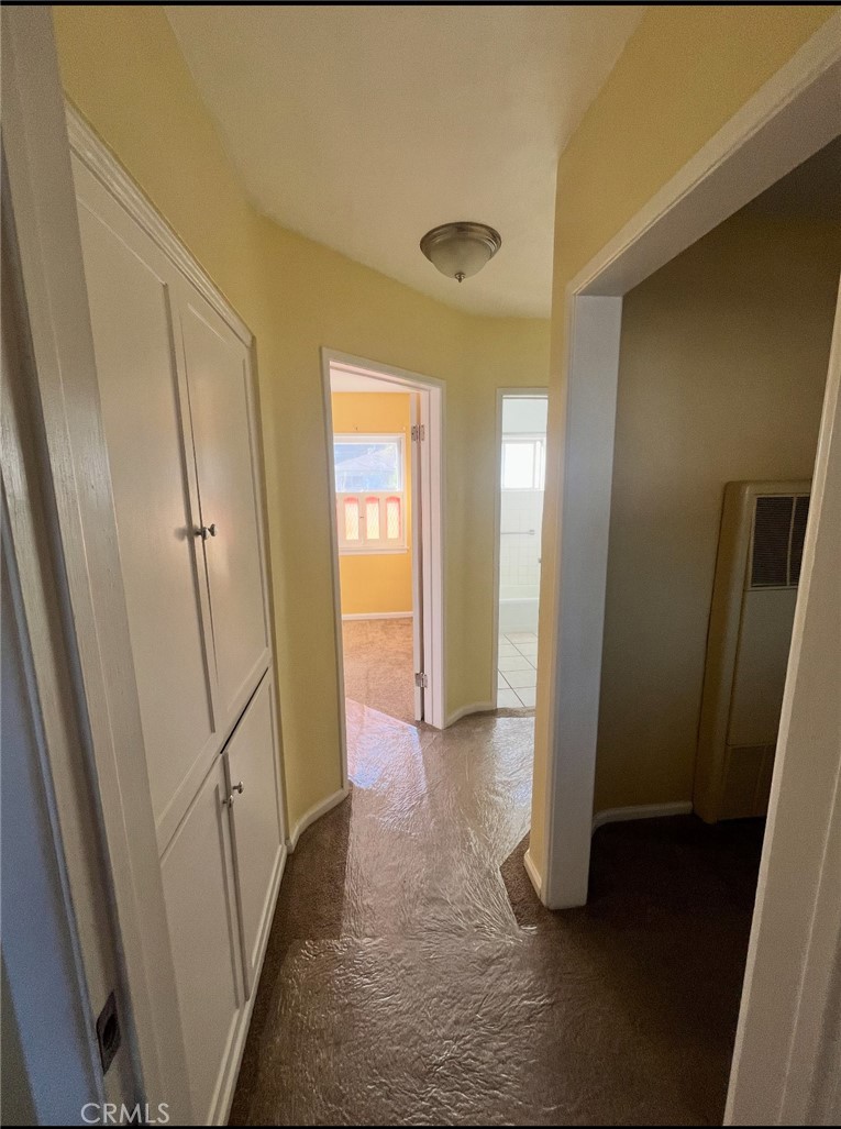 4136 Eileen Street Riverside, CA 92504 - Photo 5 of 13 a view of a hallway with wooden floor