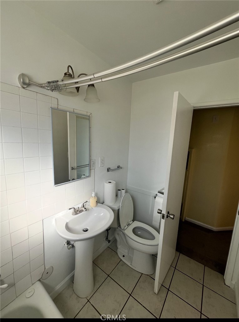 4136 Eileen Street Riverside, CA 92504 - Photo 7 of 13 a bathroom with a sink toilet and shower