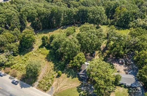 a wooden bench sitting in the middle of a forest