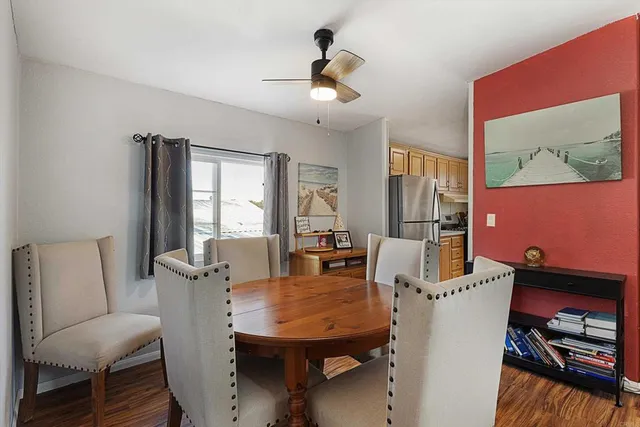 a view of a dining room with furniture and window