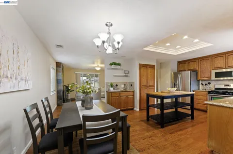 a bathroom with a granite countertop sink a mirror and vanity