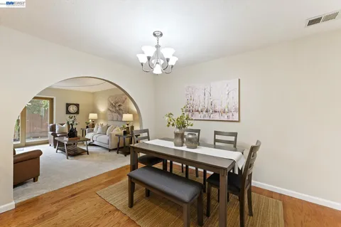 a view of a backyard with sitting area