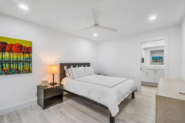 a spacious bedroom with a bed and a couch