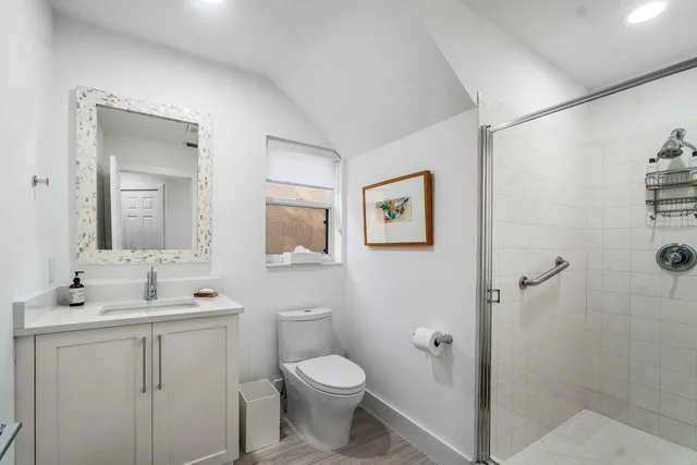 a patio with glass top table and chairs