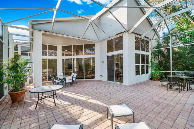 a view of a patio with a backyard table and chairs