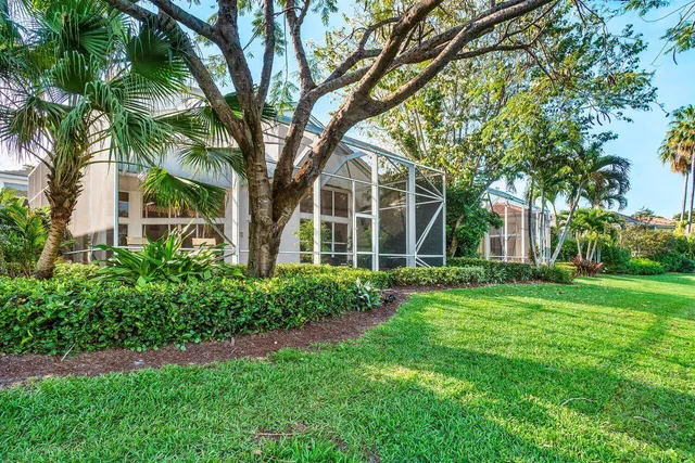 a view of a lake with houses in the back