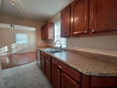 412 West South Street Crown Point, IN 46307 - Photo 5 of 12 a kitchen with stainless steel appliances granite countertop a sink stove and cabinets