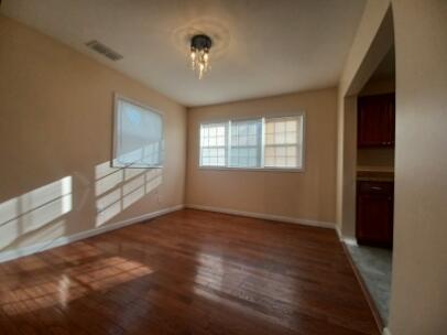 412 West South Street Crown Point, IN 46307 - Photo 7 of 12 a view of an empty room with a window and wooden floor