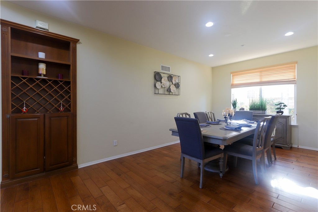 321 Tomko Way Placentia, CA 92870 - Photo 15 of 52 a view of a dining room with furniture and wooden floor