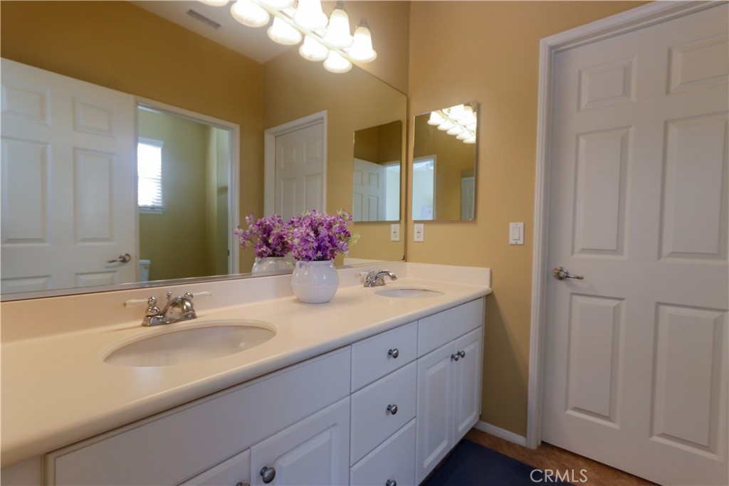 321 Tomko Way Placentia, CA 92870 - Photo 30 of 52 a bathroom with a sink and a mirror