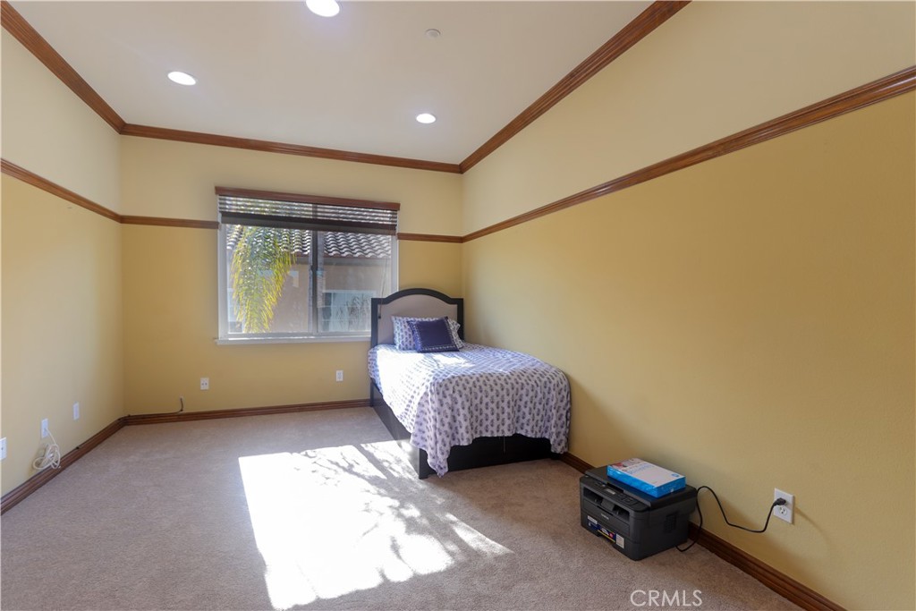 321 Tomko Way Placentia, CA 92870 - Photo 32 of 52 a spacious bedroom with a bed and a window