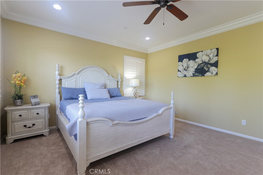 321 Tomko Way Placentia, CA 92870 - Photo 34 of 52 a spacious bedroom with a bed and a chandelier