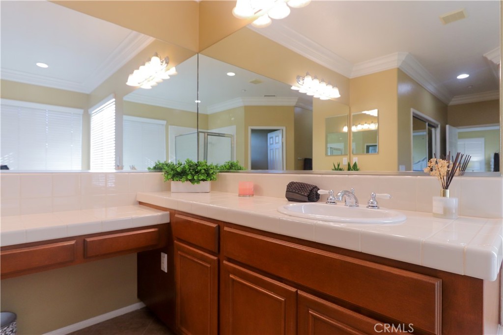 321 Tomko Way Placentia, CA 92870 - Photo 36 of 52 a bathroom with a sink and a mirror