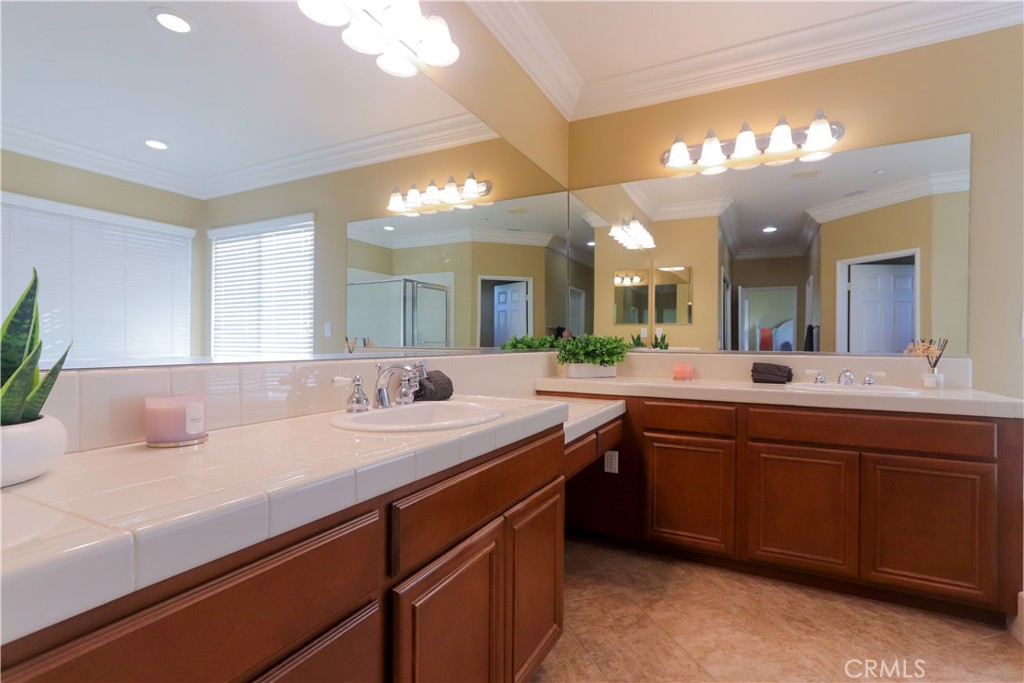 321 Tomko Way Placentia, CA 92870 - Photo 37 of 52 a bathroom with a sink vanity and a mirror