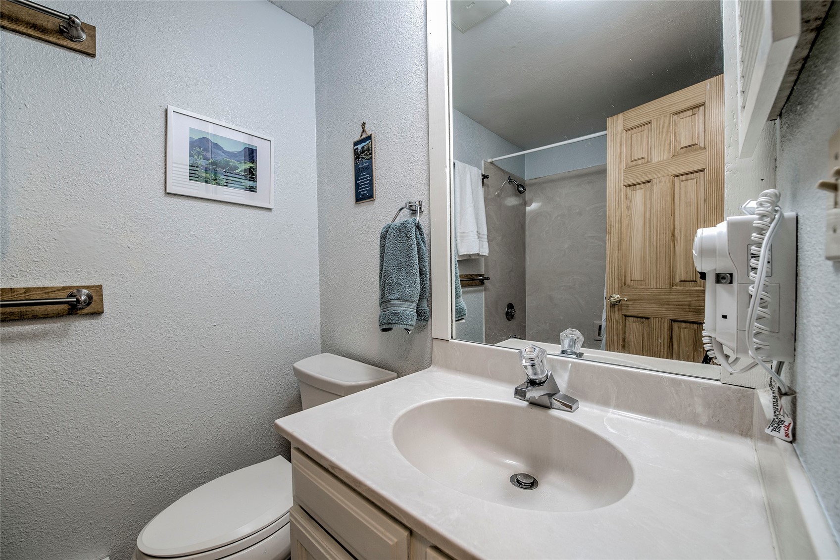 187 Fuller Placer Road, Unit B Breckenridge, CO 80424 - Photo 26 of 33 a bathroom with a sink toilet and shower