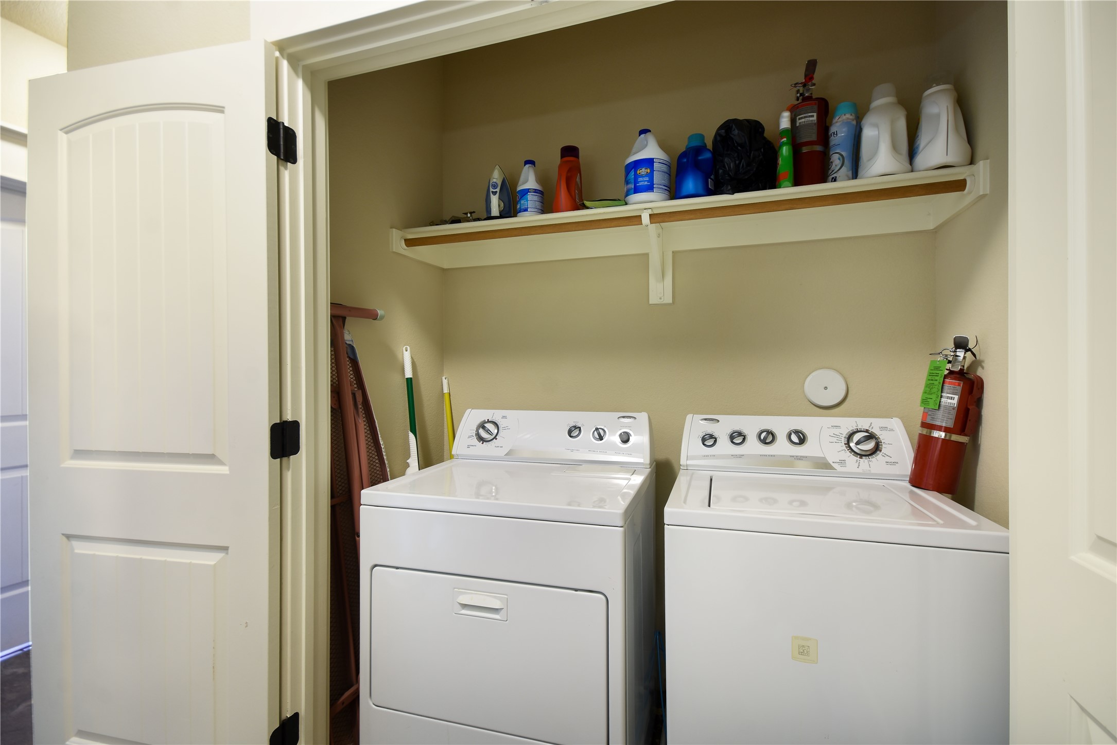 17800 Edgewood Way, Unit 203 Jonestown, TX 78645 - Photo 11 of 40 a utility room with dryer and washer
