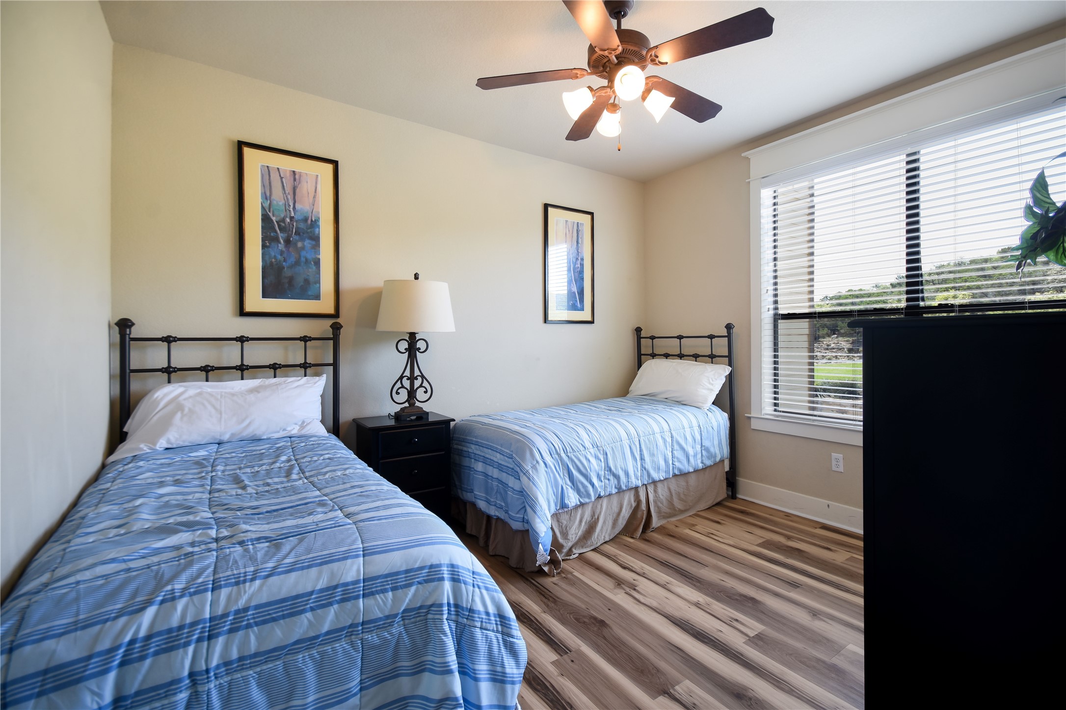17800 Edgewood Way, Unit 203 Jonestown, TX 78645 - Photo 20 of 40 a bedroom with bed and window