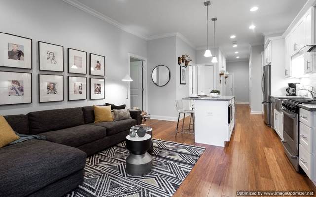 Undisclosed Address Chicago, IL 60607 - Photo 3 of 10 a living room with furniture kitchen view and a wooden floor