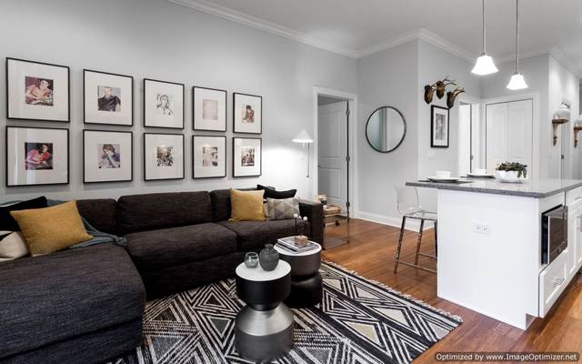 Undisclosed Address Chicago, IL 60607 - Photo 4 of 10 a living room with furniture and wooden floor