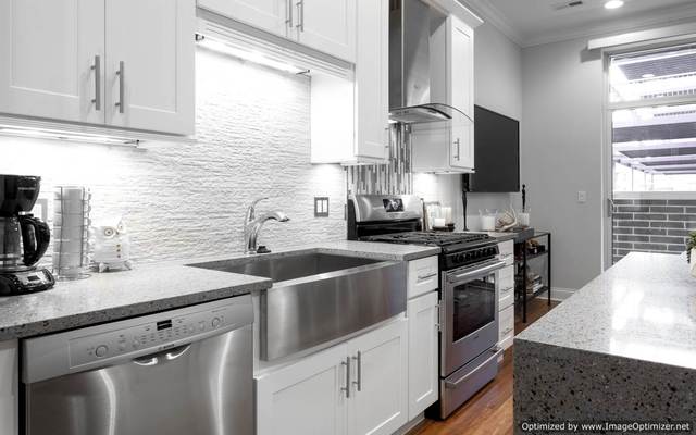 Undisclosed Address Chicago, IL 60607 - Photo 6 of 10 a kitchen with stainless steel appliances granite countertop a sink stove and refrigerator