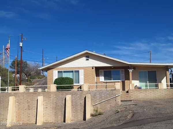 a front view of a house with garage