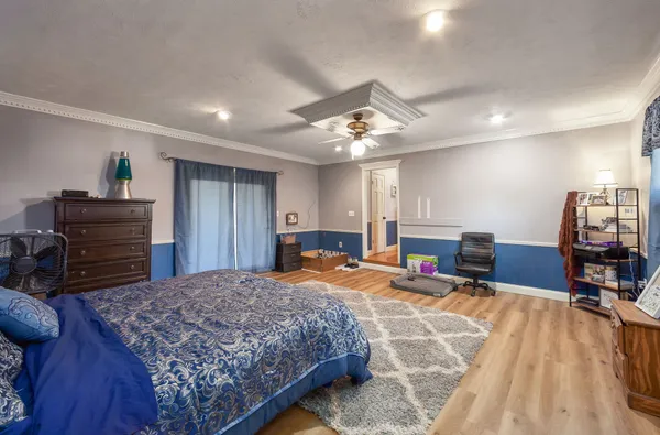 a bedroom with a bed and furniture