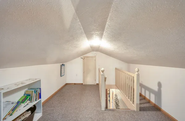 a view of a livingroom with stairs