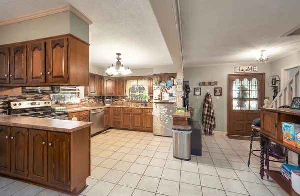 a kitchen with a sink and cabinets