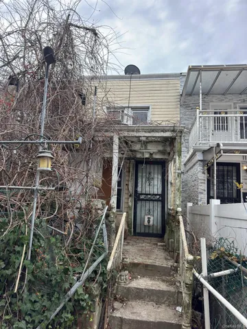a view of a house with iron stairs