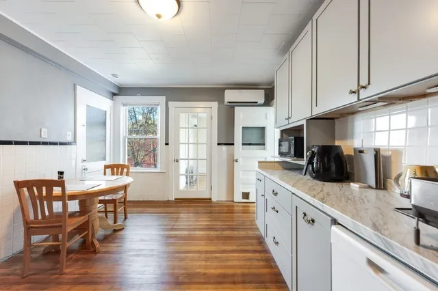 a kitchen with stainless steel appliances granite countertop counter space a sink and a refrigerator