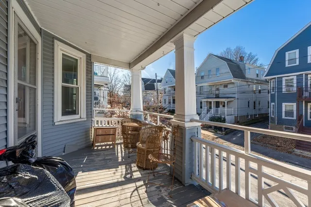 a view of a patio with chairs and tables