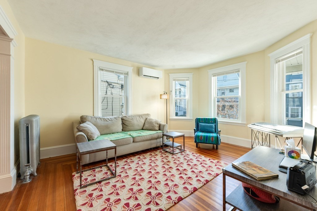 21 Ericsson Street, Unit 2 Cambridge, MA 02138 - Photo 2 of 22 a living room with furniture and a rug