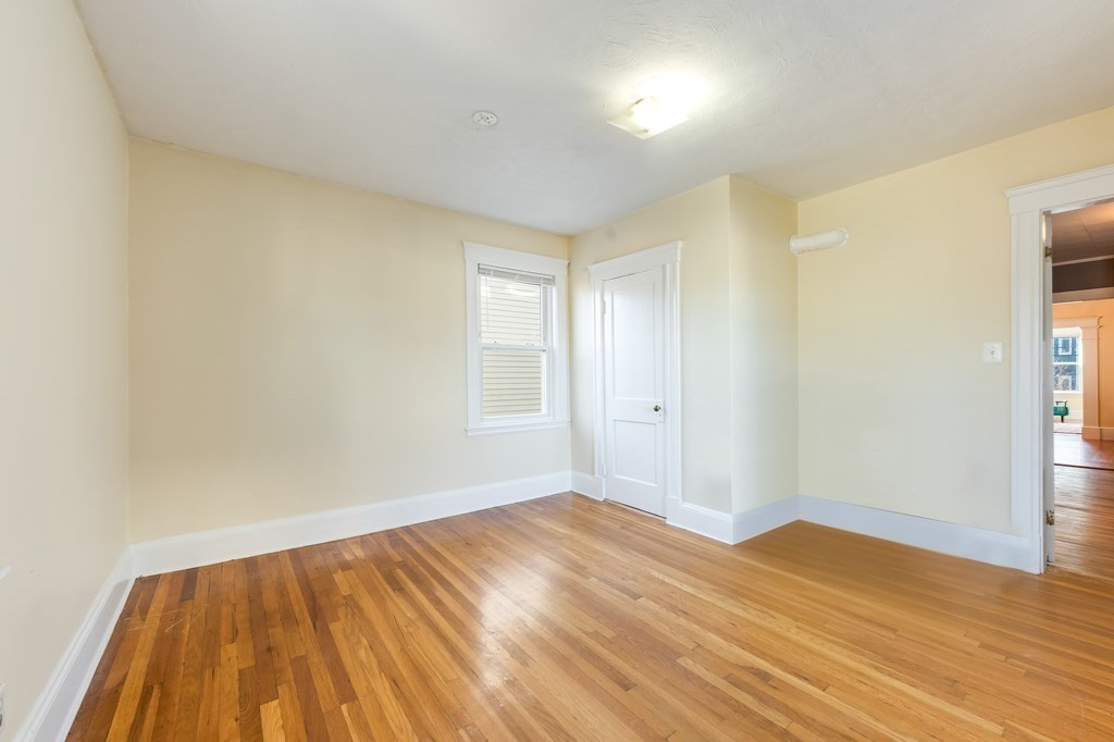 21 Ericsson Street, Unit 2 Cambridge, MA 02138 - Photo 9 of 22 a view of empty room with wooden floor and fan