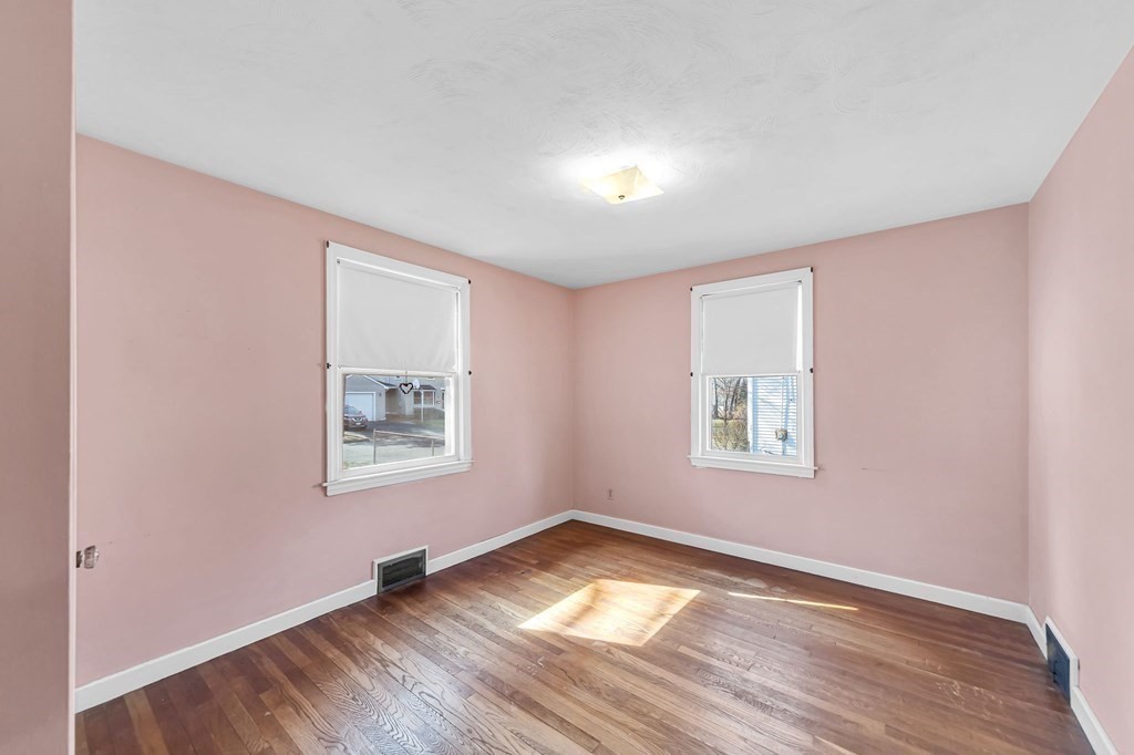 14 Franconia Street Springfield, MA 01108 - Photo 13 of 27 a view of an empty room with wooden floor and a window