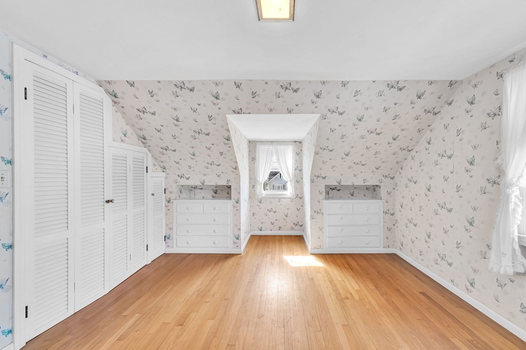 14 Franconia Street Springfield, MA 01108 - Photo 24 of 27 a view of a hallway with wooden floor and staircase