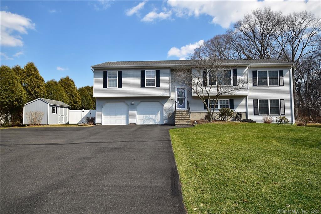 11 Dally Farm Road Windsor, CT 06095 - Photo 1 of 1 a front view of a house with a yard