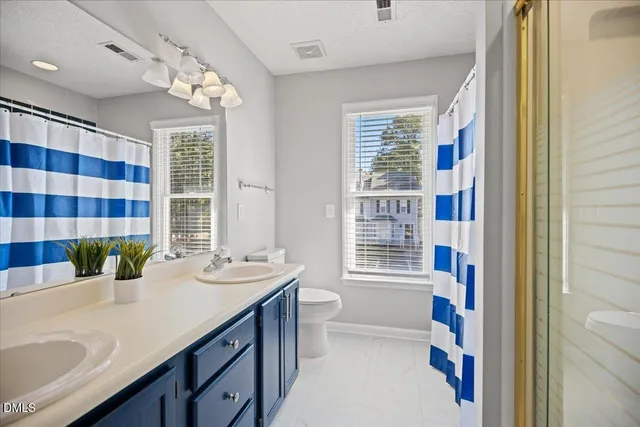 a bathroom with a sink a large mirror and a bathtub