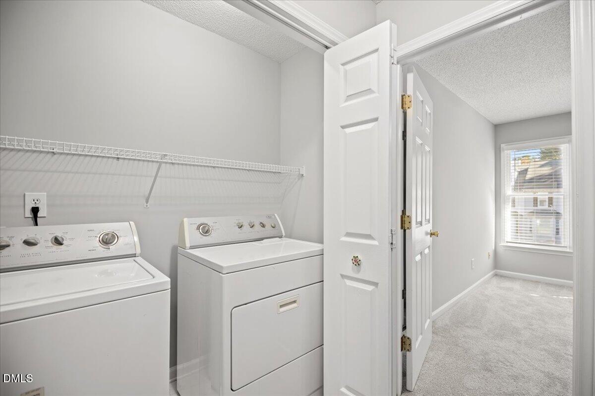6063 Epping Forest Drive Raleigh, NC 27613 - Photo 19 of 34 a view of storage and utility room with washer and dryer
