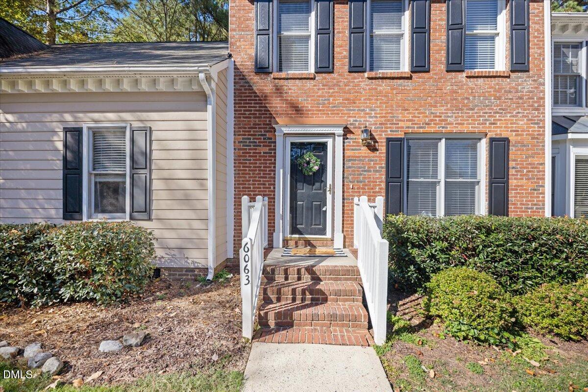 6063 Epping Forest Drive Raleigh, NC 27613 - Photo 2 of 34 front view of a brick building