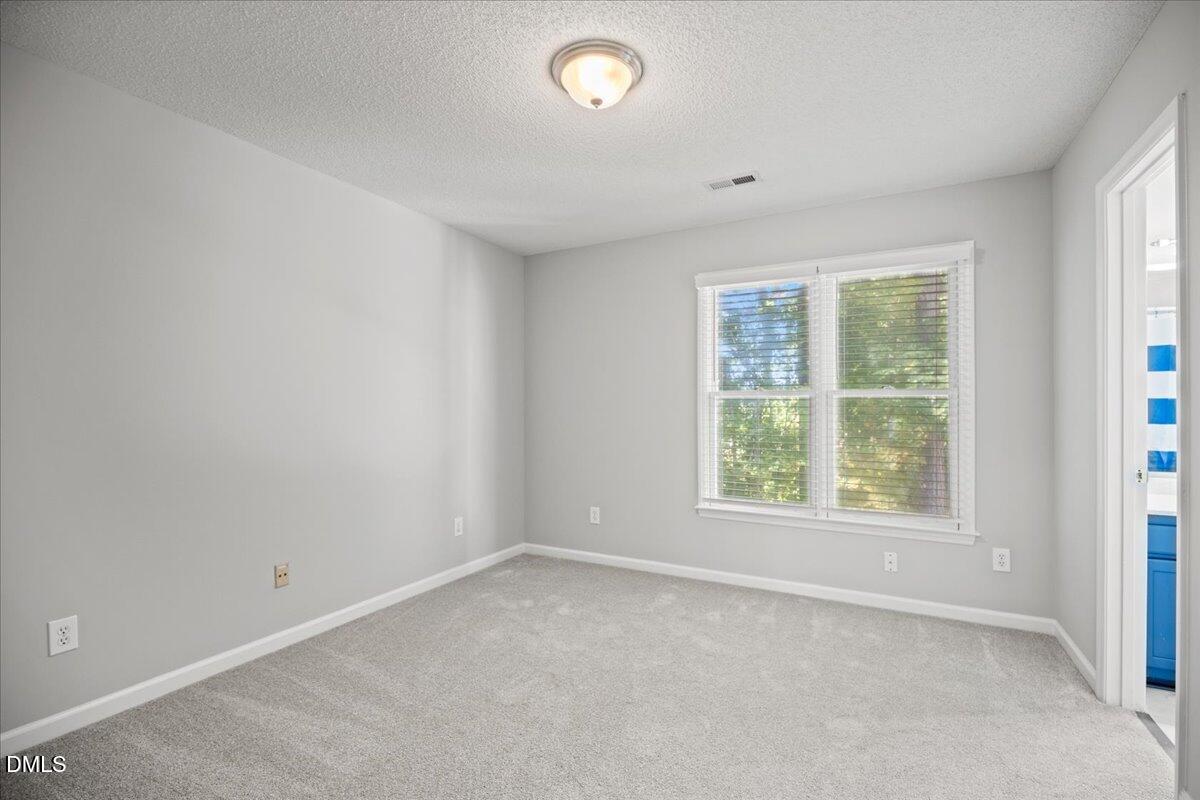 6063 Epping Forest Drive Raleigh, NC 27613 - Photo 21 of 34 an empty room with a window