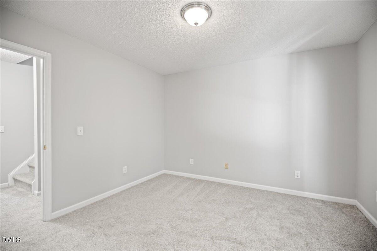 6063 Epping Forest Drive Raleigh, NC 27613 - Photo 23 of 34 a view of an empty room
