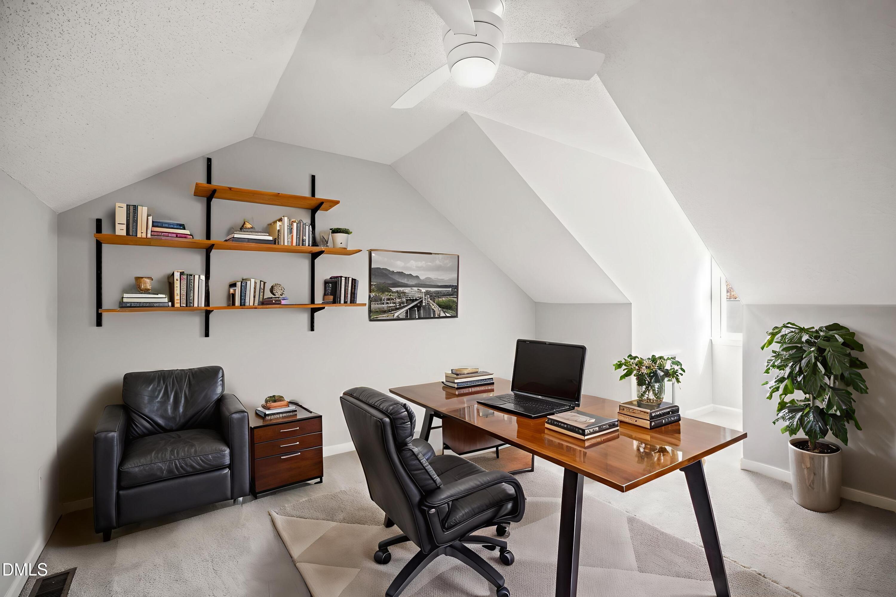 6063 Epping Forest Drive Raleigh, NC 27613 - Photo 25 of 34 a living room with furniture and a flat screen tv