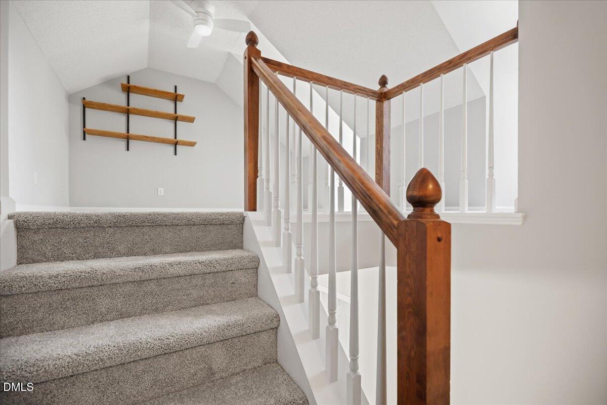 6063 Epping Forest Drive Raleigh, NC 27613 - Photo 28 of 34 a view of staircase with white walls and a window