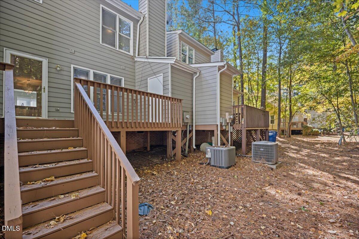 6063 Epping Forest Drive Raleigh, NC 27613 - Photo 29 of 34 a view of a patio with wooden floor and roof