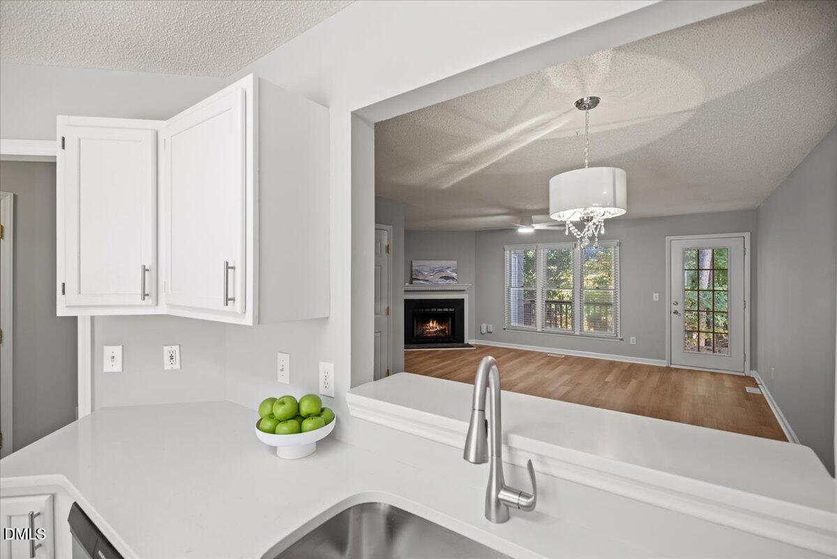 6063 Epping Forest Drive Raleigh, NC 27613 - Photo 8 of 34 a bathroom with a tub sink and mirror