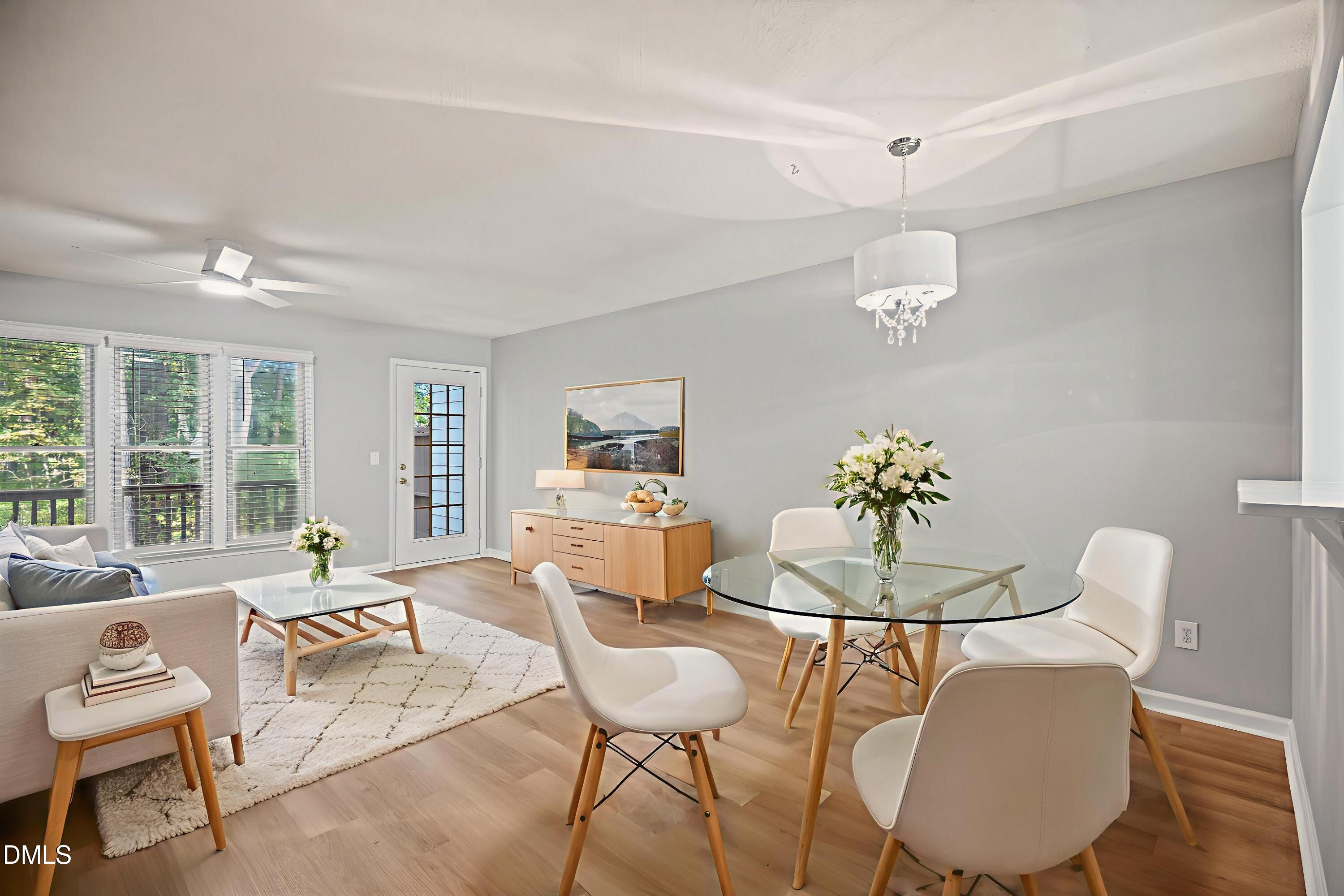 6063 Epping Forest Drive Raleigh, NC 27613 - Photo 9 of 34 a living room with furniture and a large window