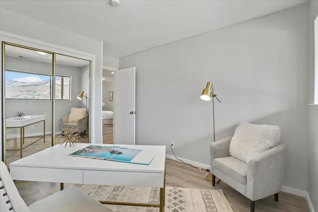 a view of a house with a wooden deck